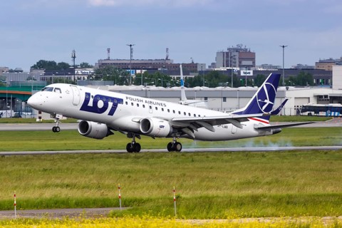 An Embraer 190 of LOT Polskie Linie Lotnicze with the registration SP-LMA lands at Warsaw Airport