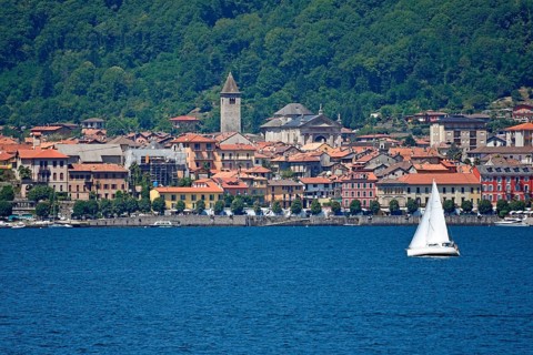Sailboat in front of the old town of Cannobio