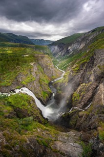 View into the river valley with waterfall Voringfossen