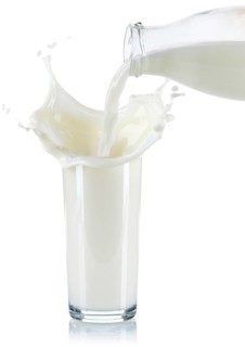 Milk splash squirt splash pour pour glass cropped cropped isolated against a white background