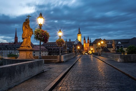 Old bridge over the river Main at dawn