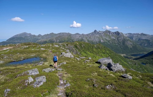 Hiker on the trail to the mountain Rundfjellet