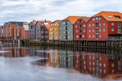 Colourful historic warehouses by the river Nidelva