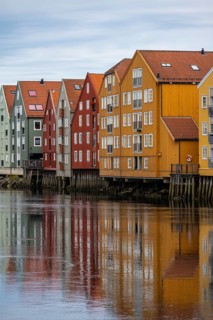 Colourful historic warehouses by the river Nidelva