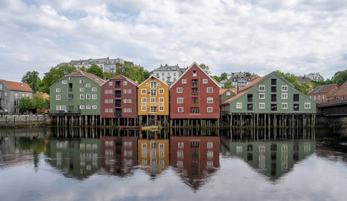 Colourful historic warehouses by the river Nidelva