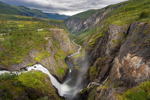 View into the river valley with waterfall Voringfossen