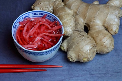 Pickled ginger in small bowls and ginger root