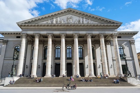 People sunbathing in front of the opera