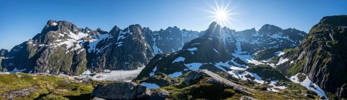 Sun shining on mountains with snow