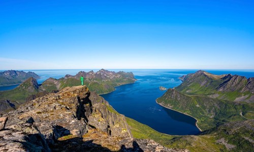 Hiker standing on top of Grytetippen