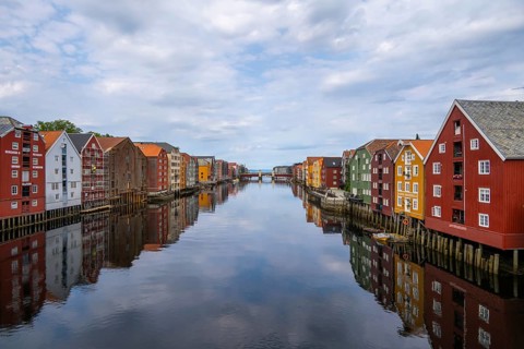 Colourful historic warehouses by the river Nidelva