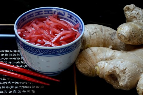 Pickled ginger in small bowls and ginger root
