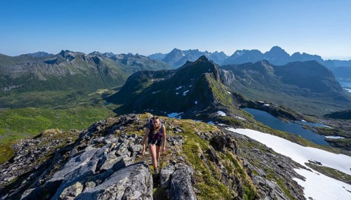 Hiker on the trail to the mountain Rundfjellet