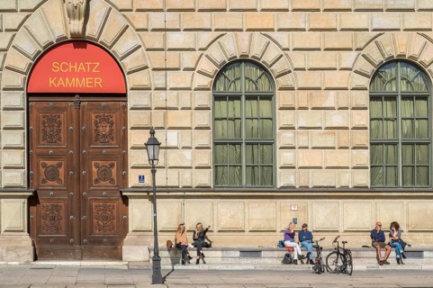 People sunbathing in front of the Residenz