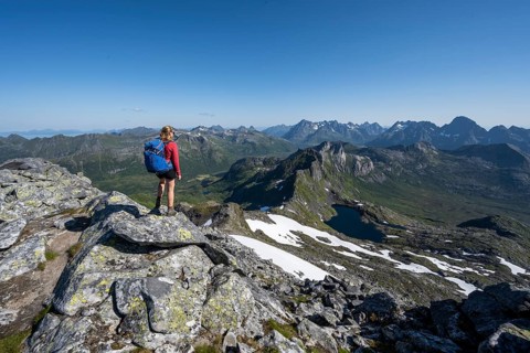 Hiker on the trail to the mountain Rundfjellet
