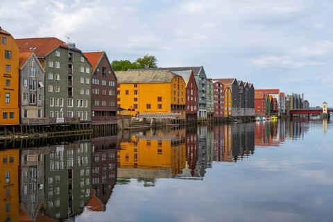 Colourful historic warehouses by the river Nidelva