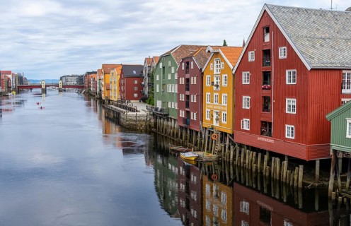 Colourful historic warehouses by the river Nidelva