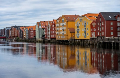 Colourful historic warehouses by the river Nidelva