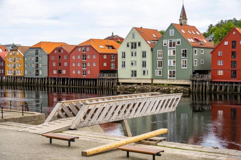 Colourful historic warehouses by the river Nidelva