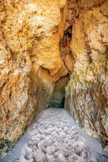 Rock cave washed out by the sea on the beach
