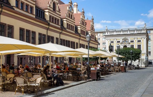 Naschmarkt with street cafe and Old Stock Exchange