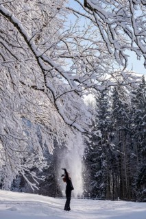Woman enjoying the snow during winter walk
