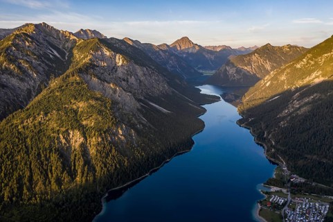 View from the summit of Schoenjoechl to Plansee and mountains at morning sun