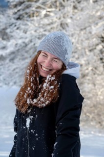 Woman enjoying the snow during winter walk