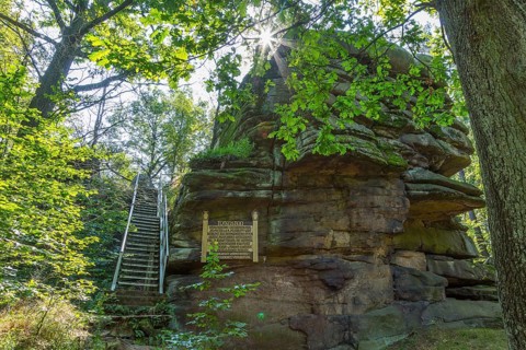 Rock formation Totenstein with information board and stairs to climb