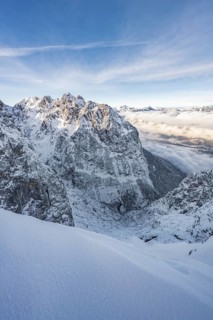 View of snowy Waxenstein and cloudy valley