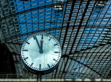 The station clock shows five to twelve