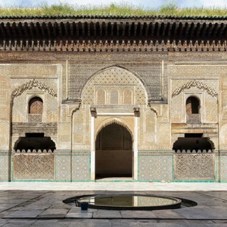 Wooden facade with ornaments and mosaics