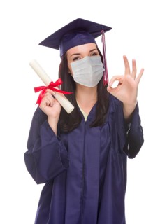 Graduating female wearing medical face mask and cap and gown isolated on a white background