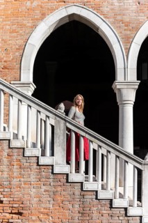 Young woman walking down a staircase