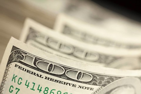 An abstract of one hundred dollar bills with narrow depth of field