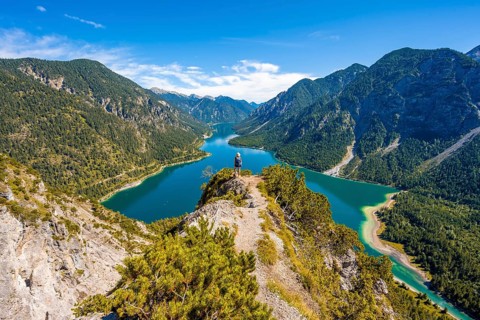 Hiker looking at Plansee