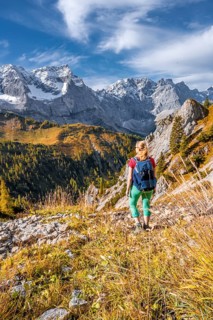 Hiker on hiking trail in the mountains