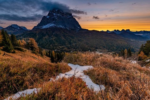 Peak of Monte Pelmo at sunrise with autumn landscape