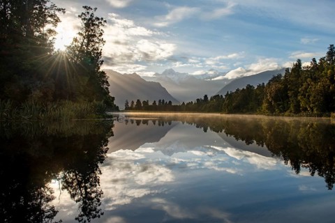 View of Mount Cook in morning light with sun star