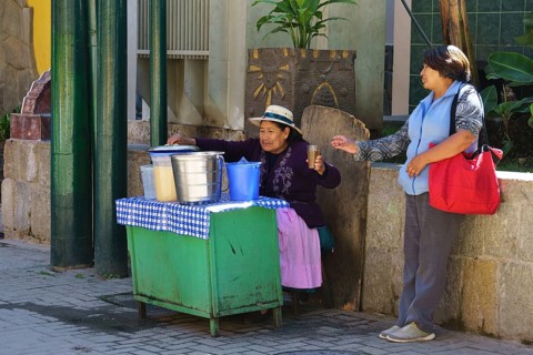 Old woman selling juices at the train station