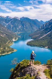 Hiker looking at Plansee