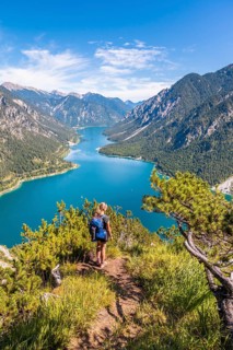 Hiker looking at Plansee