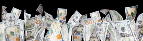 Several one hundred dollar bills falling at base of black page