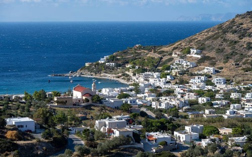 View of the village and the bay of Kini with the church Ekklisia Panagia
