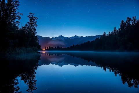 View of Mount Cook and Mount Tasman with starry sky