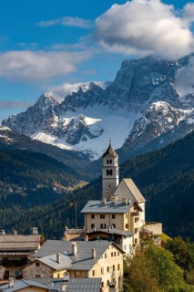 Church of Colle Santa Lucia with peak of Monte Pelmo in the background