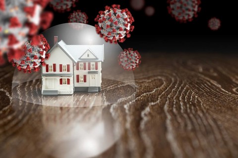 House under protective dome surrounded by floating coronavirus molecules