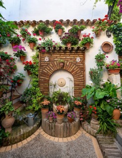 Fountain in the courtyard decorated with flowers