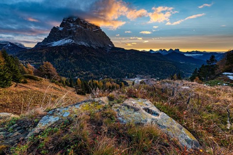 Peak of Monte Pelmo at sunrise with autumn landscape