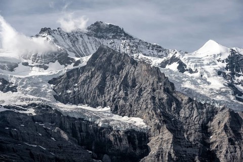 Snow covered mountain peaks Jungfrau and Silberhorn with glacier Jungfraufirn